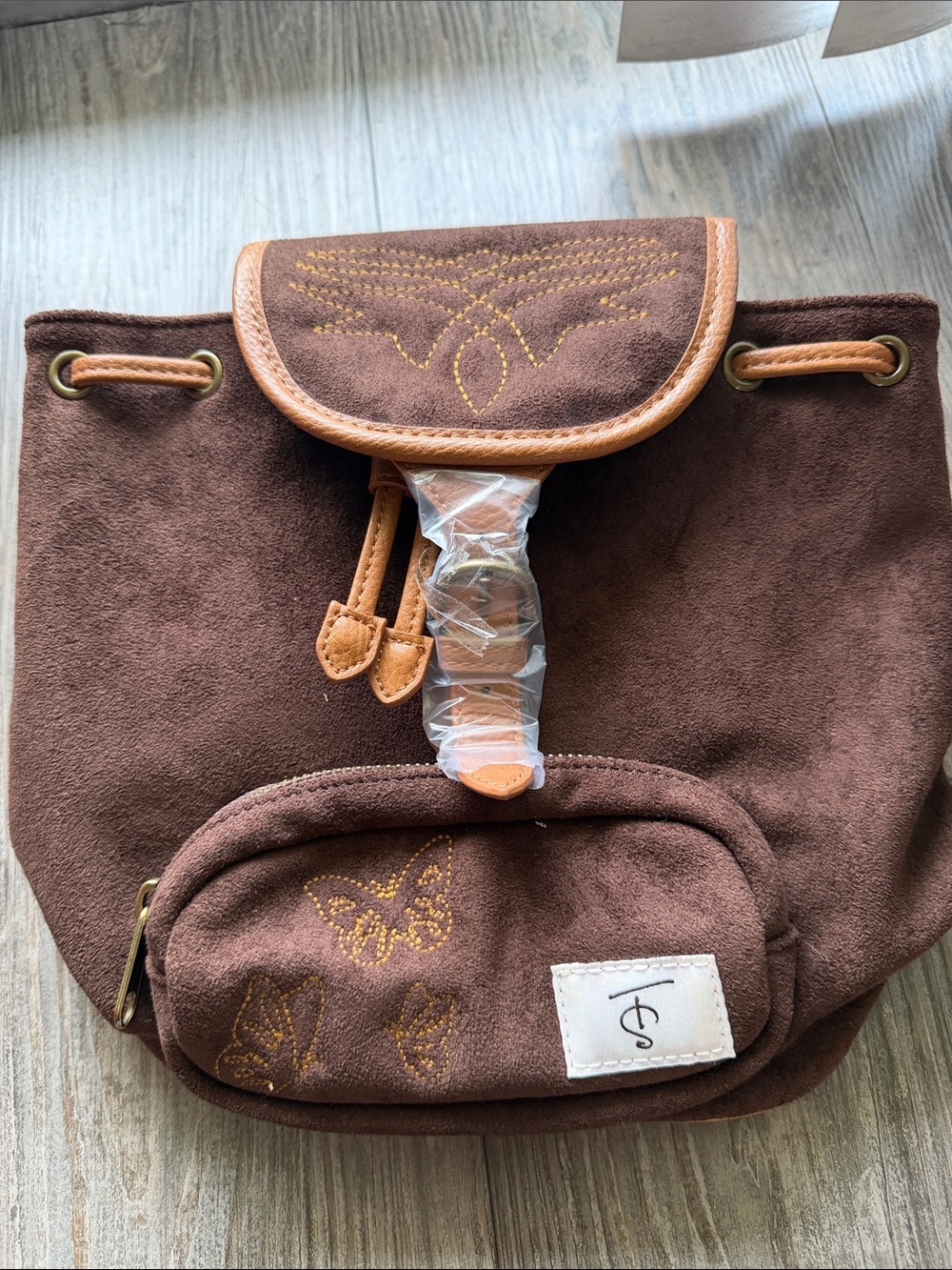 Brown Suede Drawstring Backpack with Butterfly Detail